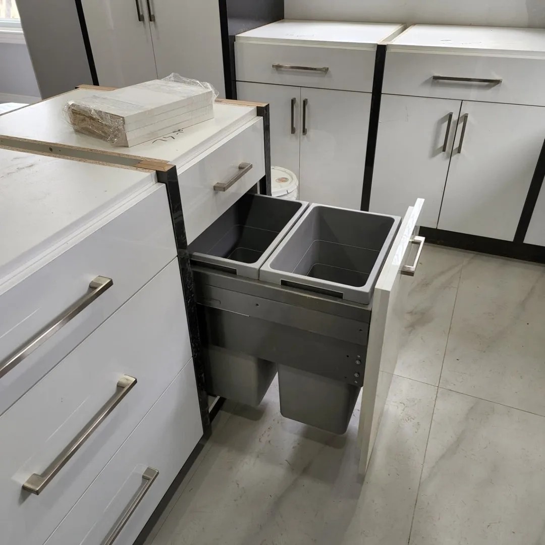 Custom white kitchen with white oak island and quartz counters in Whitby, Ontario