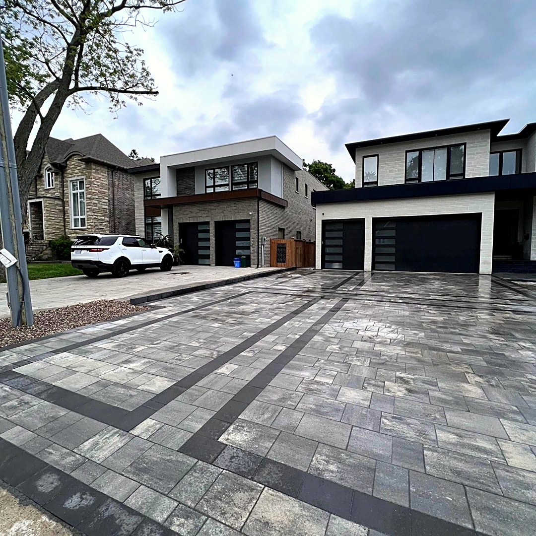 Modern interlocking paver driveway with charcoal banding