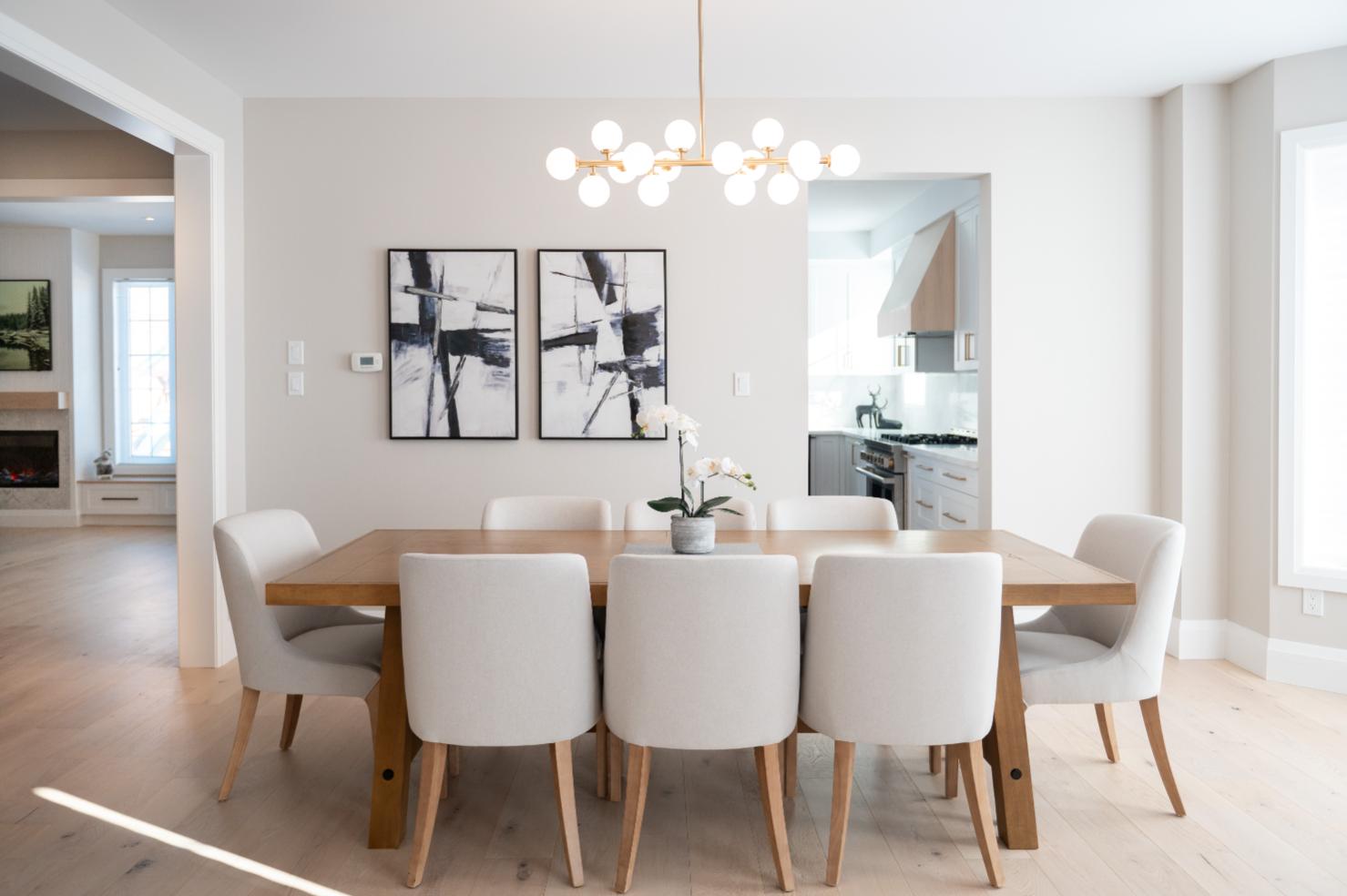Bright dining room with brass chandelier and white oak flooring