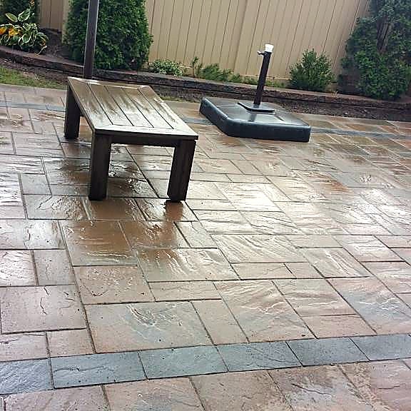 Finished interlocking stone patio by A New Look Construction